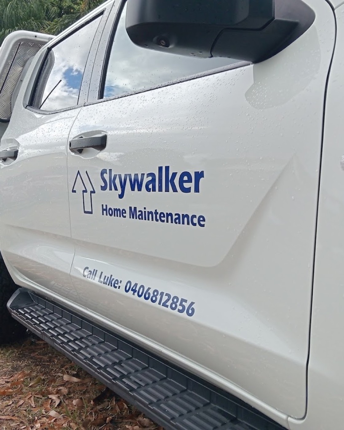 The Skywalker Home Maintenance ute signwritten with the business name and Luke's phone number