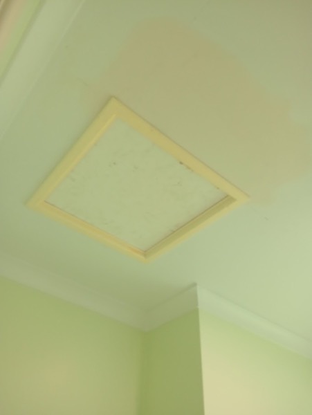 A ceiling access hatch reset into the sheet and taped